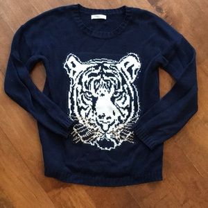 Blue sweater with tiger face on it